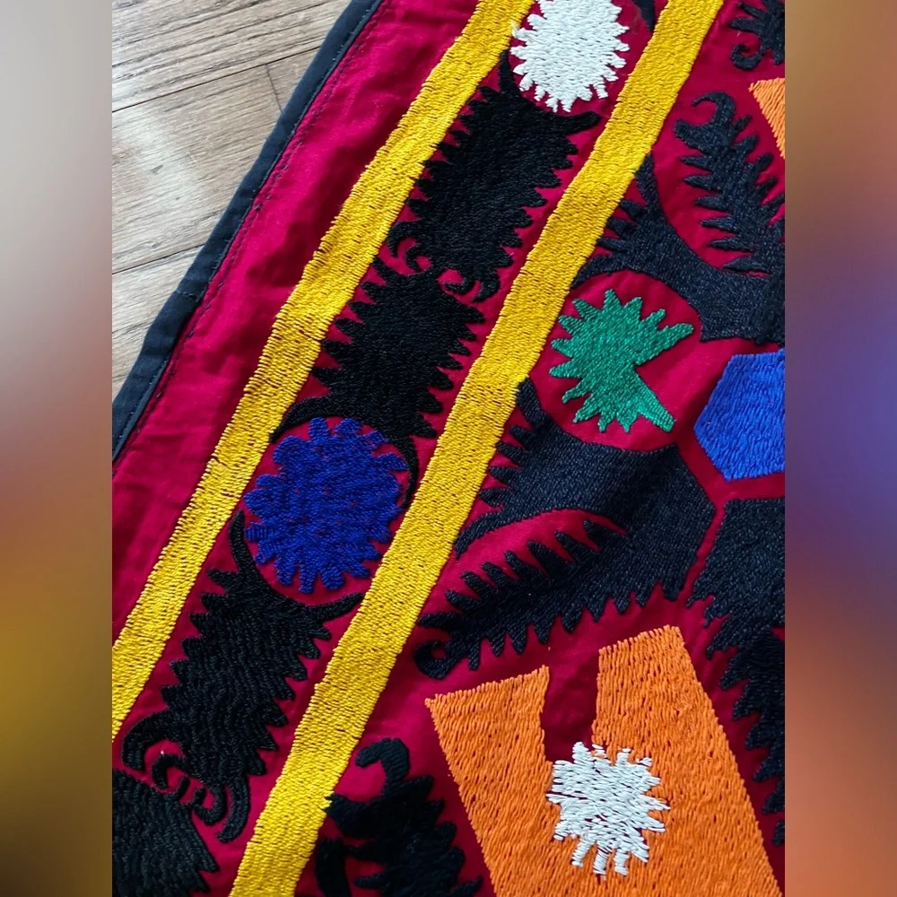 Suzane embroidered with cotton threads on cotton red fabric, hand made